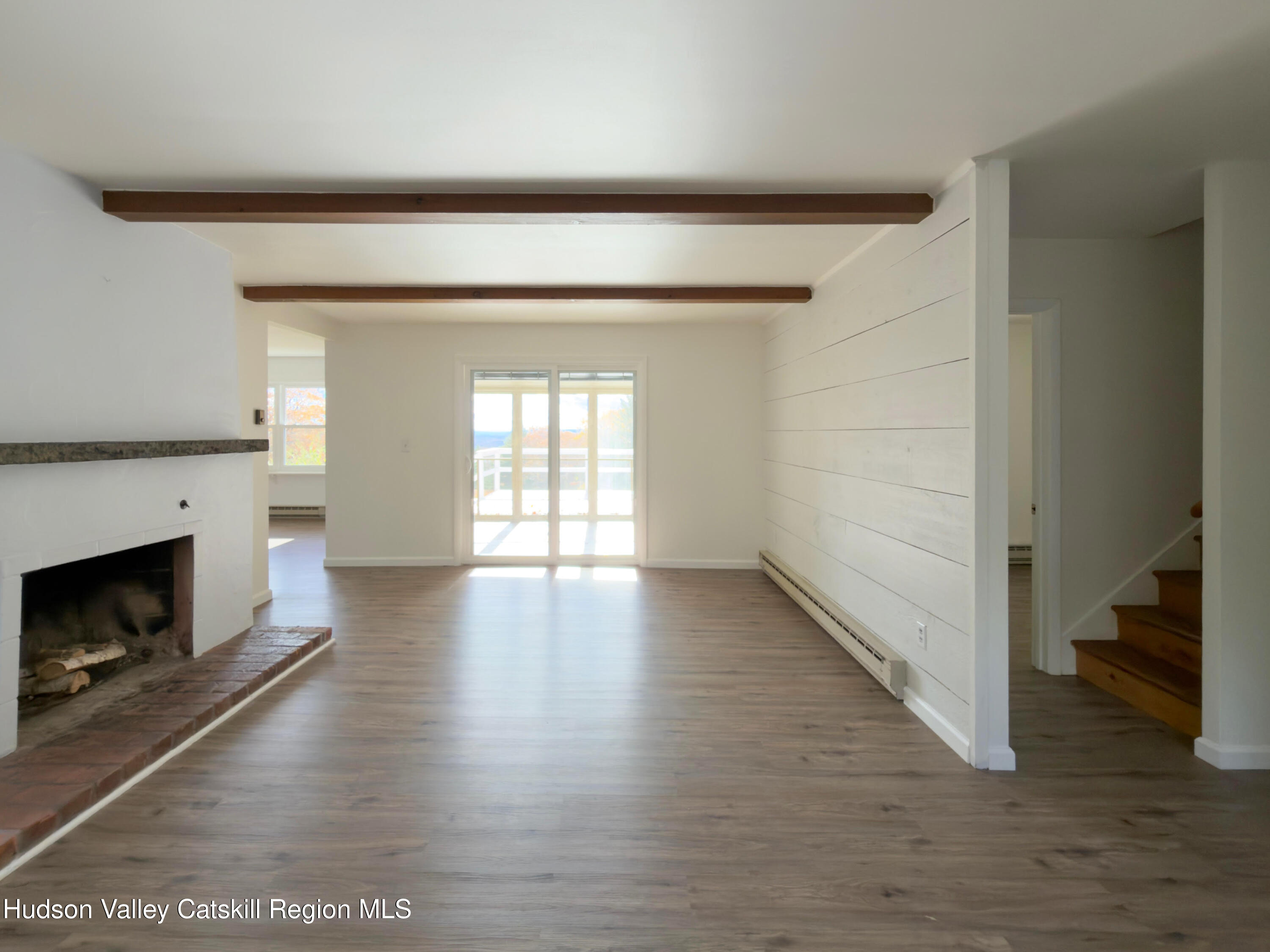 13 Heyden Road Shokan, NY 12481 - Photo 17 of 37 a view of a livingroom with wooden floor and a fireplace