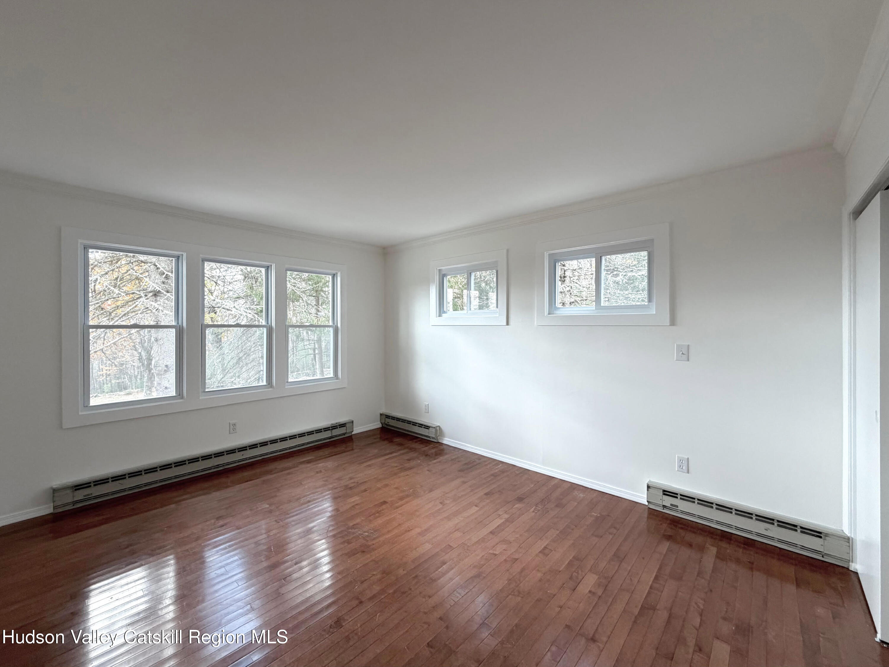 13 Heyden Road Shokan, NY 12481 - Photo 19 of 37 a view of an empty room with a window and wooden floor