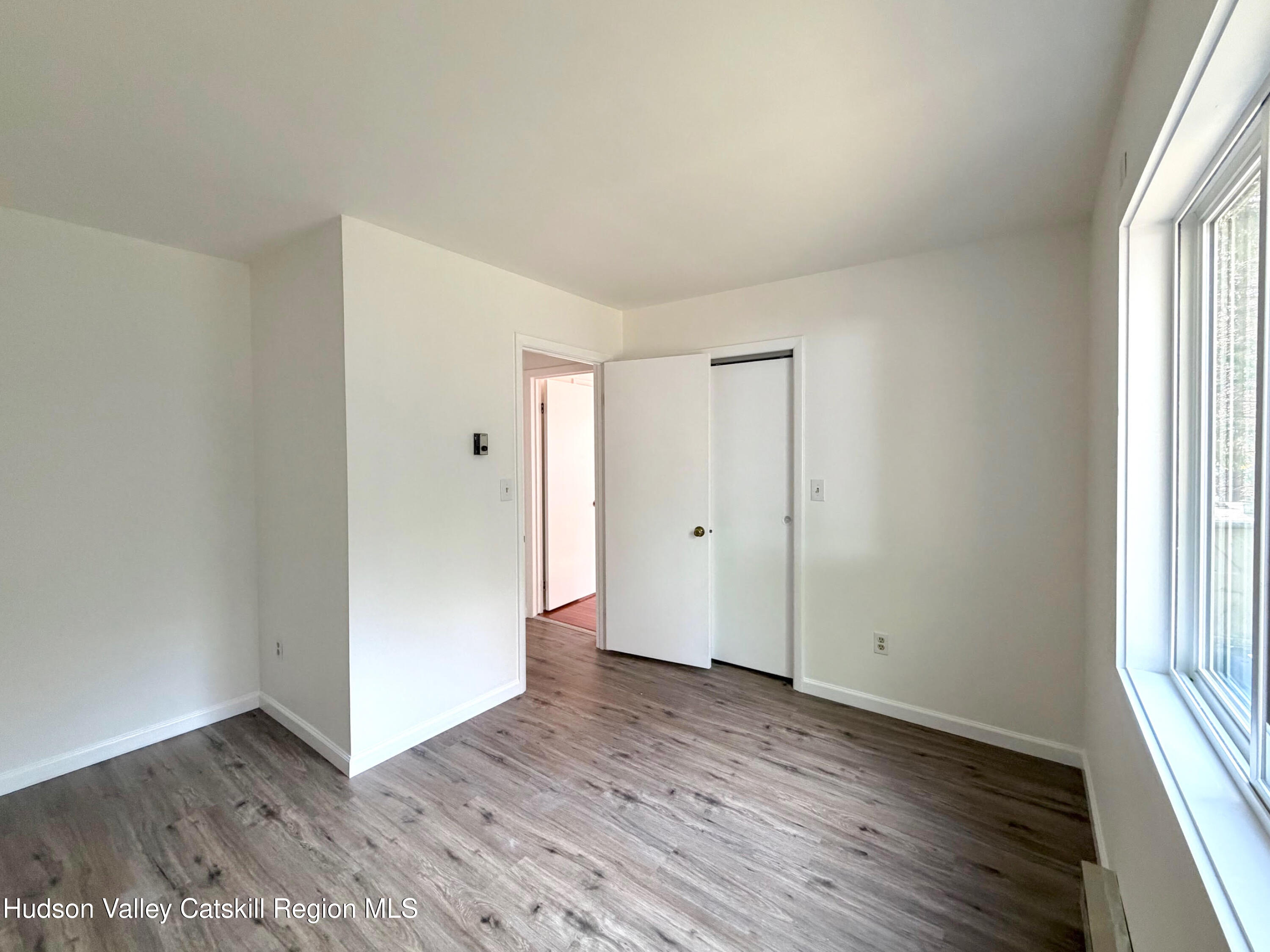 13 Heyden Road Shokan, NY 12481 - Photo 23 of 37 an empty room with wooden floor and windows