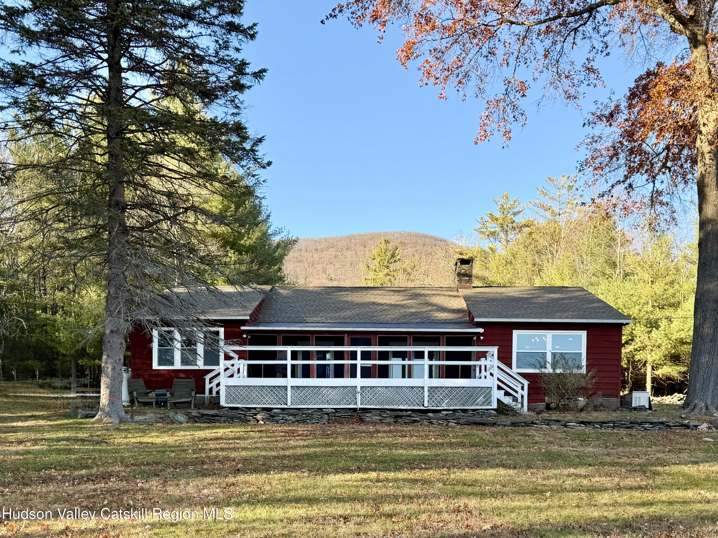 13 Heyden Road Shokan, NY 12481 - Photo 3 of 37 a view of a large pool with a lawn chairs under an umbrella