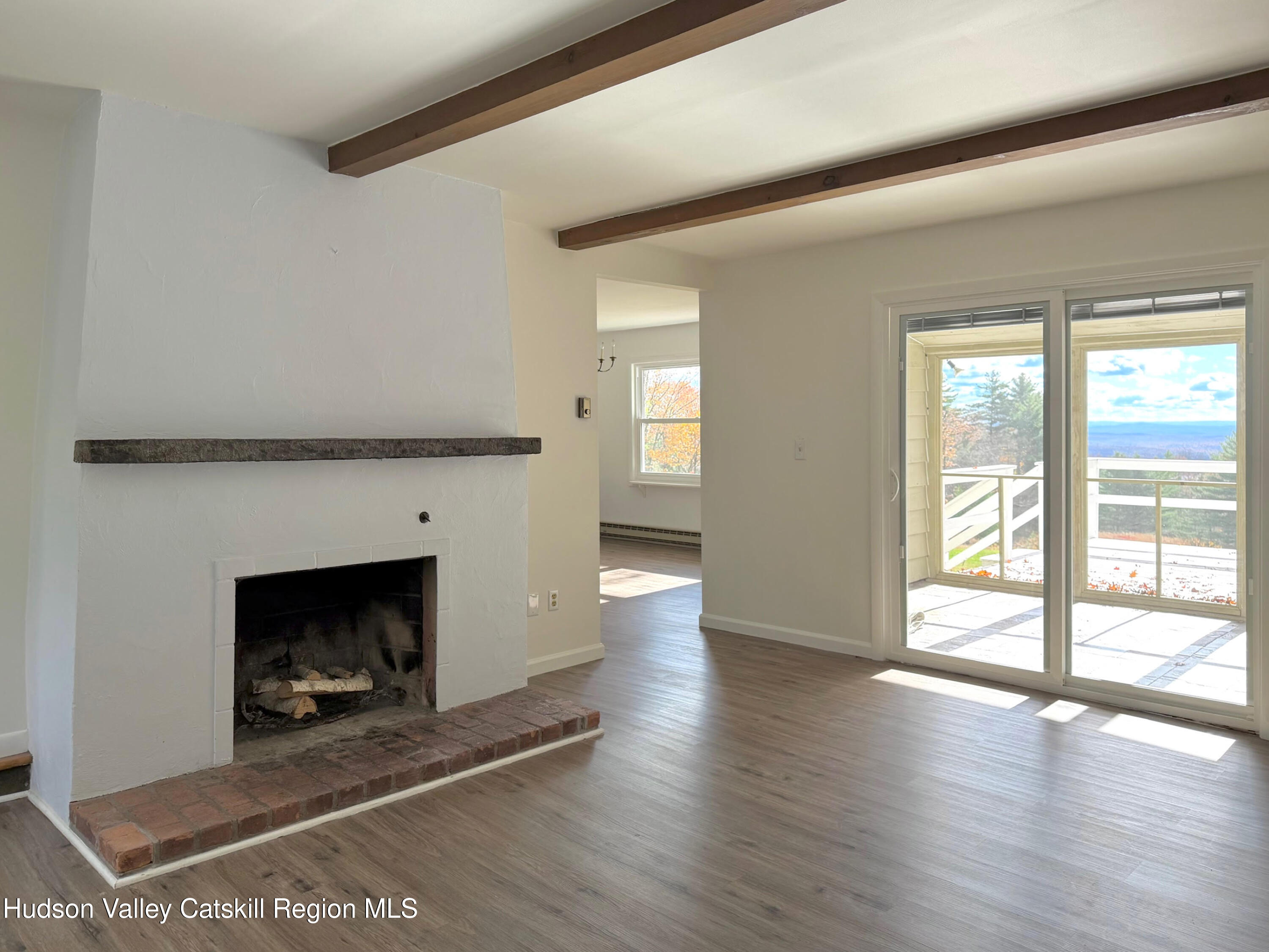 13 Heyden Road Shokan, NY 12481 - Photo 4 of 37 wooden floor fireplace and windows in an empty room