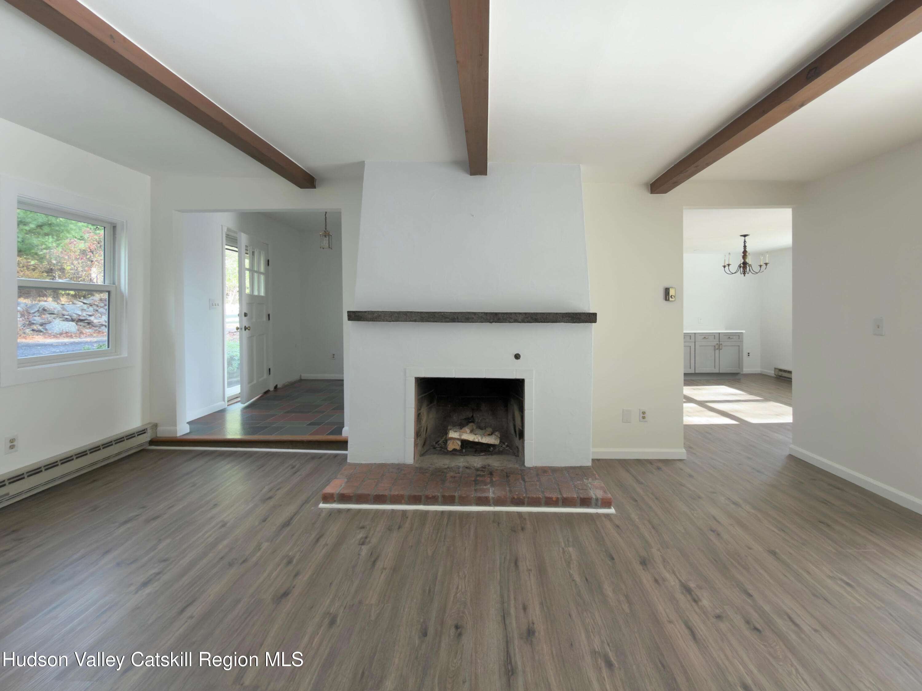 13 Heyden Road Shokan, NY 12481 - Photo 8 of 37 an empty room with wooden floor fire place and windows
