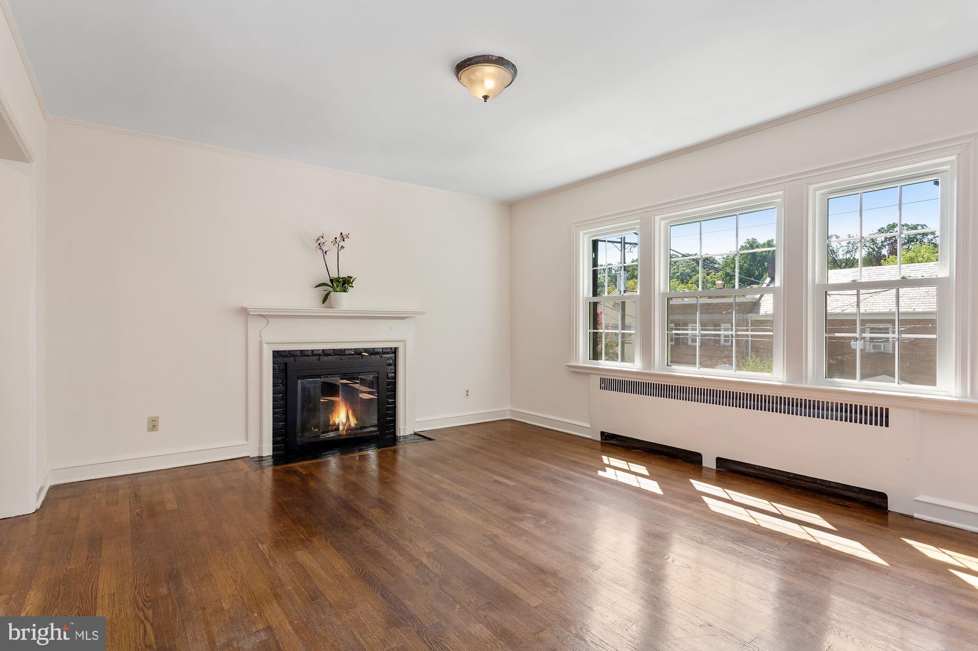2121 Tunlaw Road Northwest Washington, DC 20007 - Photo 6 of 35 Living Room with Fireplace