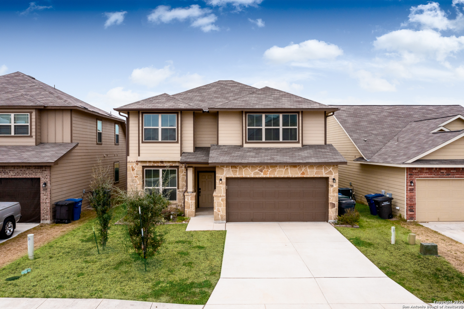 7119 Geranium Path San Antonio, TX 78218 - Photo 1 of 1 a front view of a house with a yard