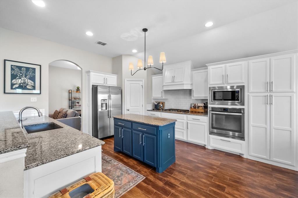 7224 Prestwick Terrace Benbrook, TX 76126 - Photo 14 of 39 a large kitchen with granite countertop a large counter top space appliances and cabinets