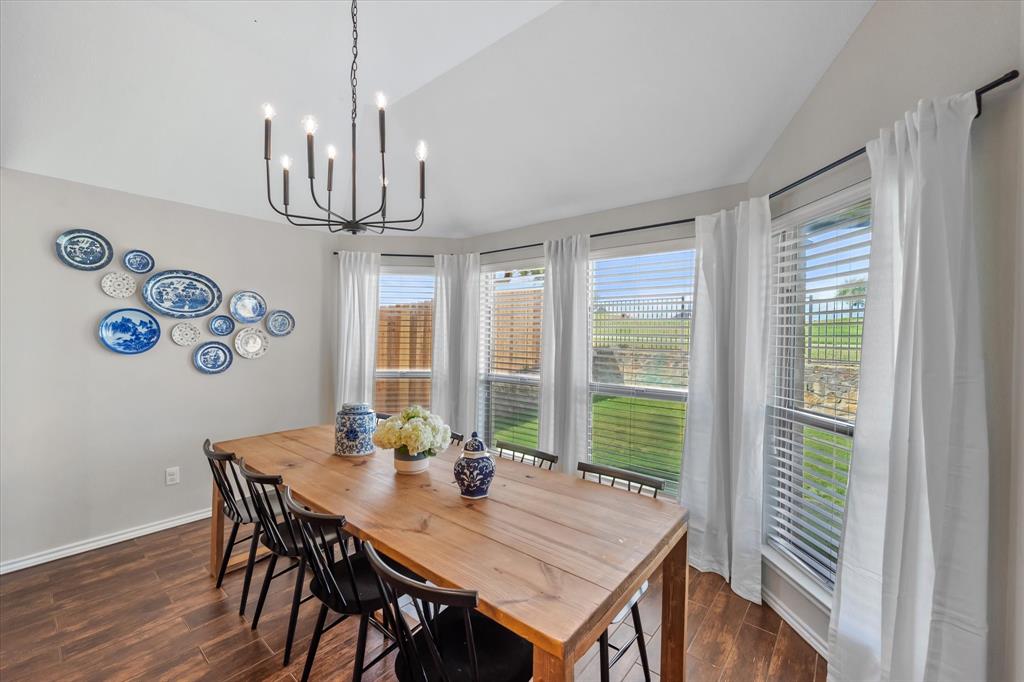 7224 Prestwick Terrace Benbrook, TX 76126 - Photo 21 of 39 a view of a dining room with furniture window and wooden floor