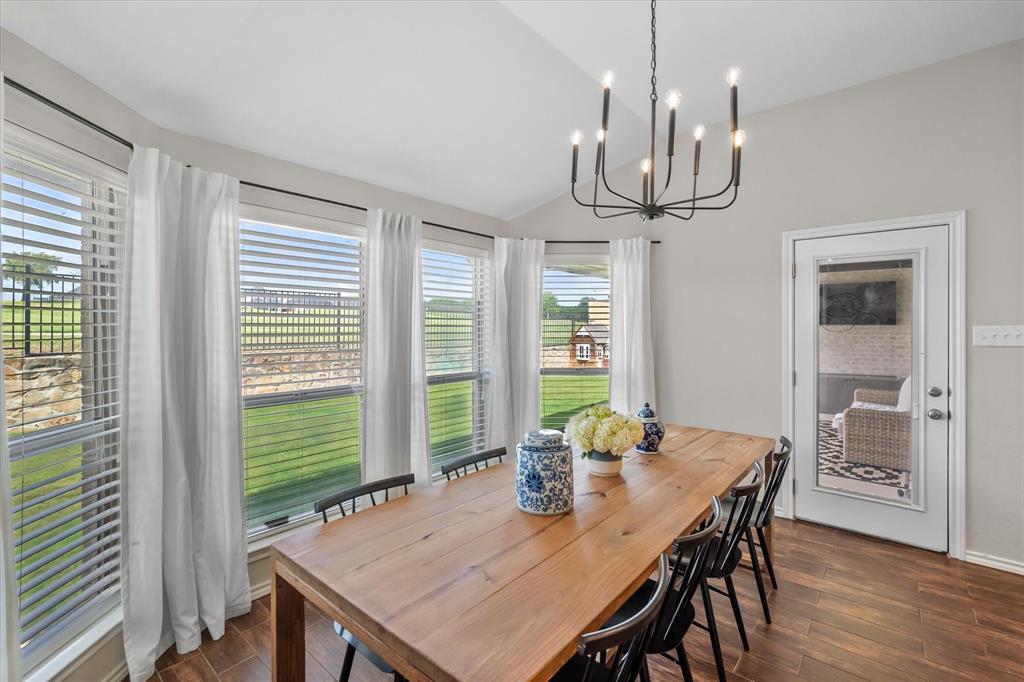 7224 Prestwick Terrace Benbrook, TX 76126 - Photo 22 of 39 a view of a dining room with furniture window and wooden floor