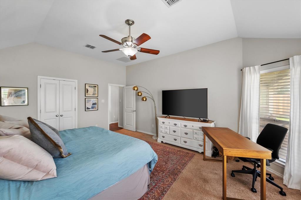 7224 Prestwick Terrace Benbrook, TX 76126 - Photo 26 of 39 a bedroom with a bed and a flat screen tv