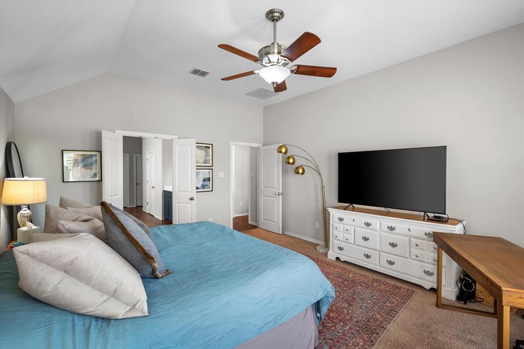 7224 Prestwick Terrace Benbrook, TX 76126 - Photo 27 of 39 a bedroom with furniture and a flat screen tv