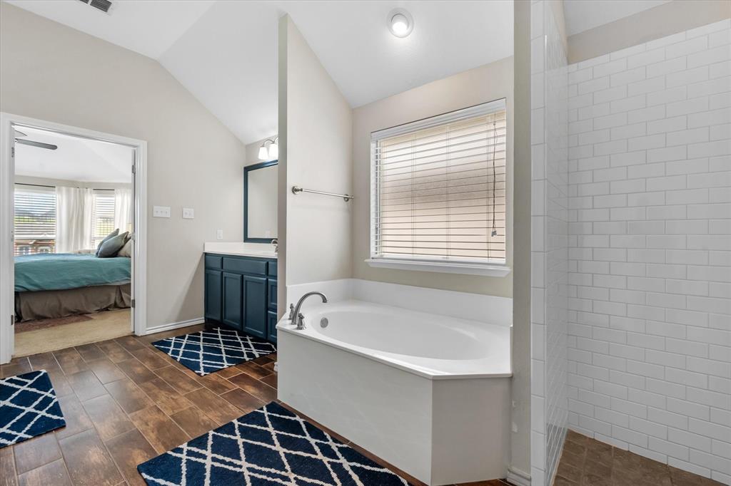 7224 Prestwick Terrace Benbrook, TX 76126 - Photo 30 of 39 a bathroom with a bathtub and a shower