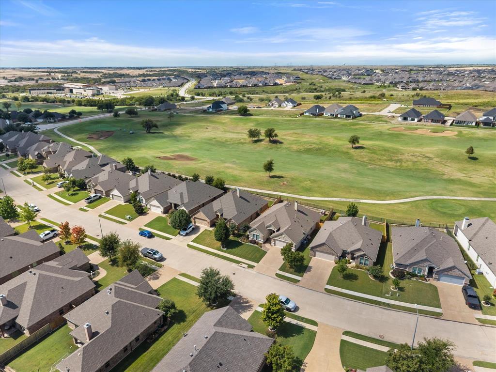 7224 Prestwick Terrace Benbrook, TX 76126 - Photo 3 of 39 an aerial view of a city with lots of residential buildings and ocean view in back