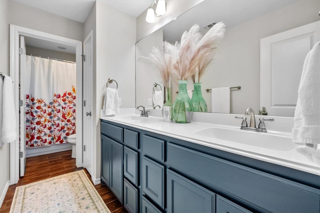 7224 Prestwick Terrace Benbrook, TX 76126 - Photo 33 of 39 a bathroom with a double vanity sink mirror and shower