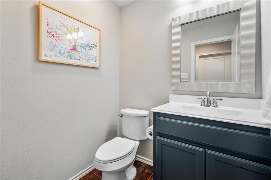 7224 Prestwick Terrace Benbrook, TX 76126 - Photo 34 of 39 a bathroom with a toilet a sink and mirror