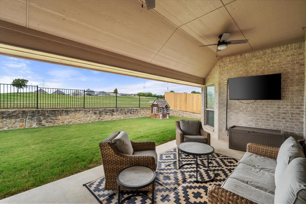 7224 Prestwick Terrace Benbrook, TX 76126 - Photo 36 of 39 a view of a patio with couches chairs and a big yard