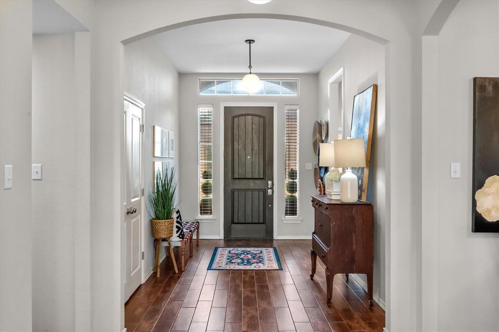 7224 Prestwick Terrace Benbrook, TX 76126 - Photo 6 of 39 a view of a hallway view with wooden floor and staircase