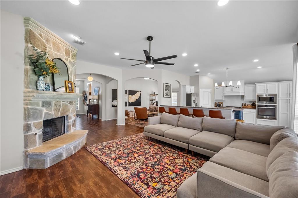 7224 Prestwick Terrace Benbrook, TX 76126 - Photo 9 of 39 a living room with furniture kitchen view and a fireplace