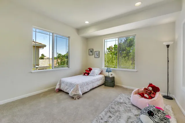 a bedroom with a bed and window