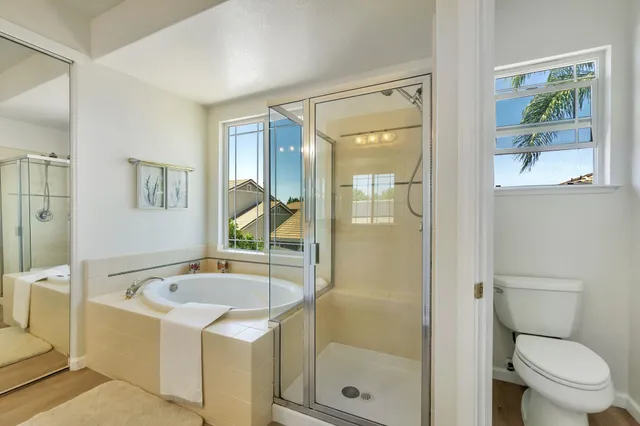 a bathroom with a bathtub and a shower