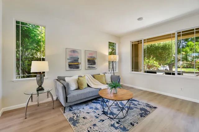 a living room with furniture and a large window