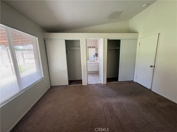 a view of empty room with windows