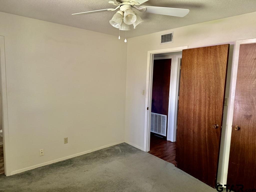 1102 Chad Whitehouse, TX 75791 - Photo 14 of 16 an empty room with closet and windows