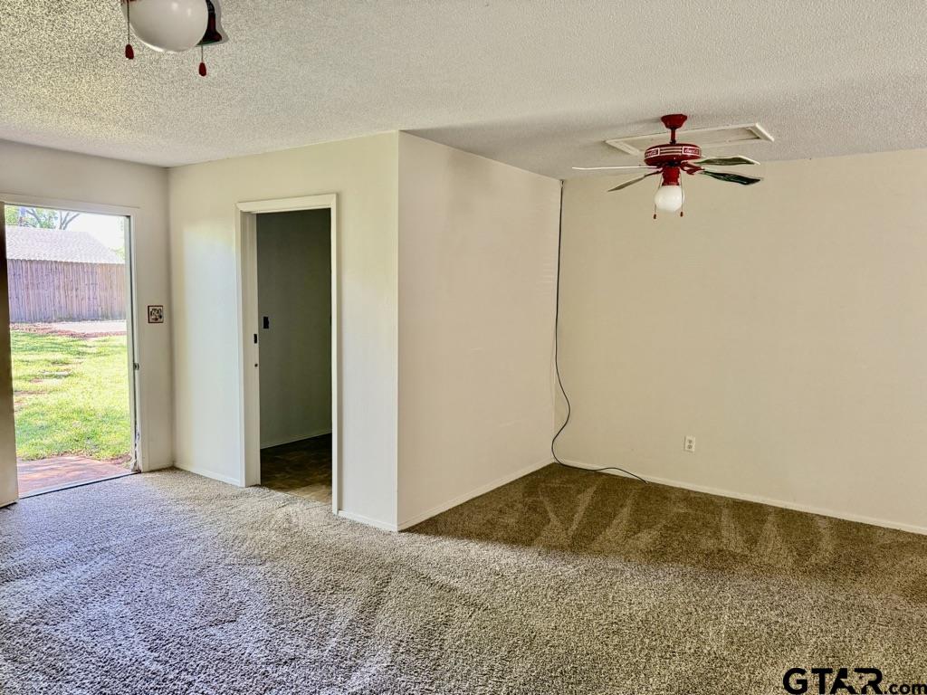 1102 Chad Whitehouse, TX 75791 - Photo 7 of 16 a view of a livingroom with a ceiling fan and window