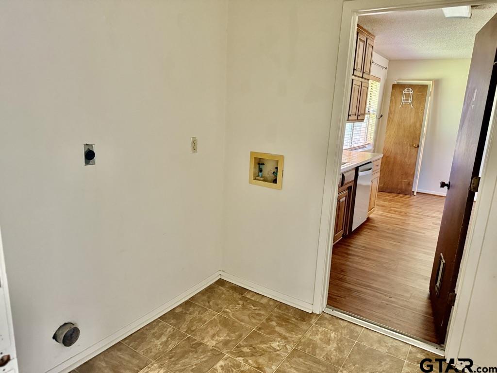1102 Chad Whitehouse, TX 75791 - Photo 8 of 16 a view of a hallway with wooden floor and staircase