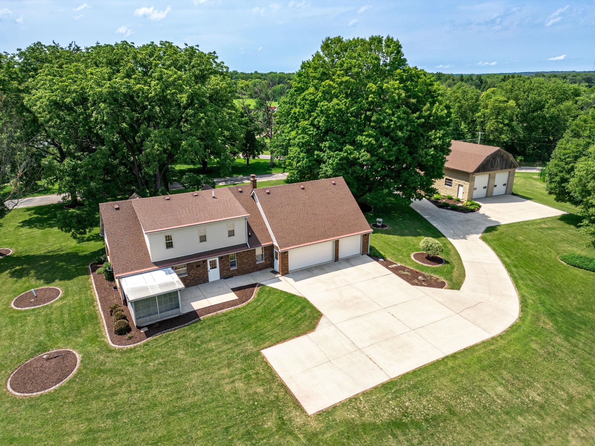 7918 Rothwell Road Rockford, IL 61109 - Photo 3 of 49 an aerial view of a house with swimming pool garden and patio