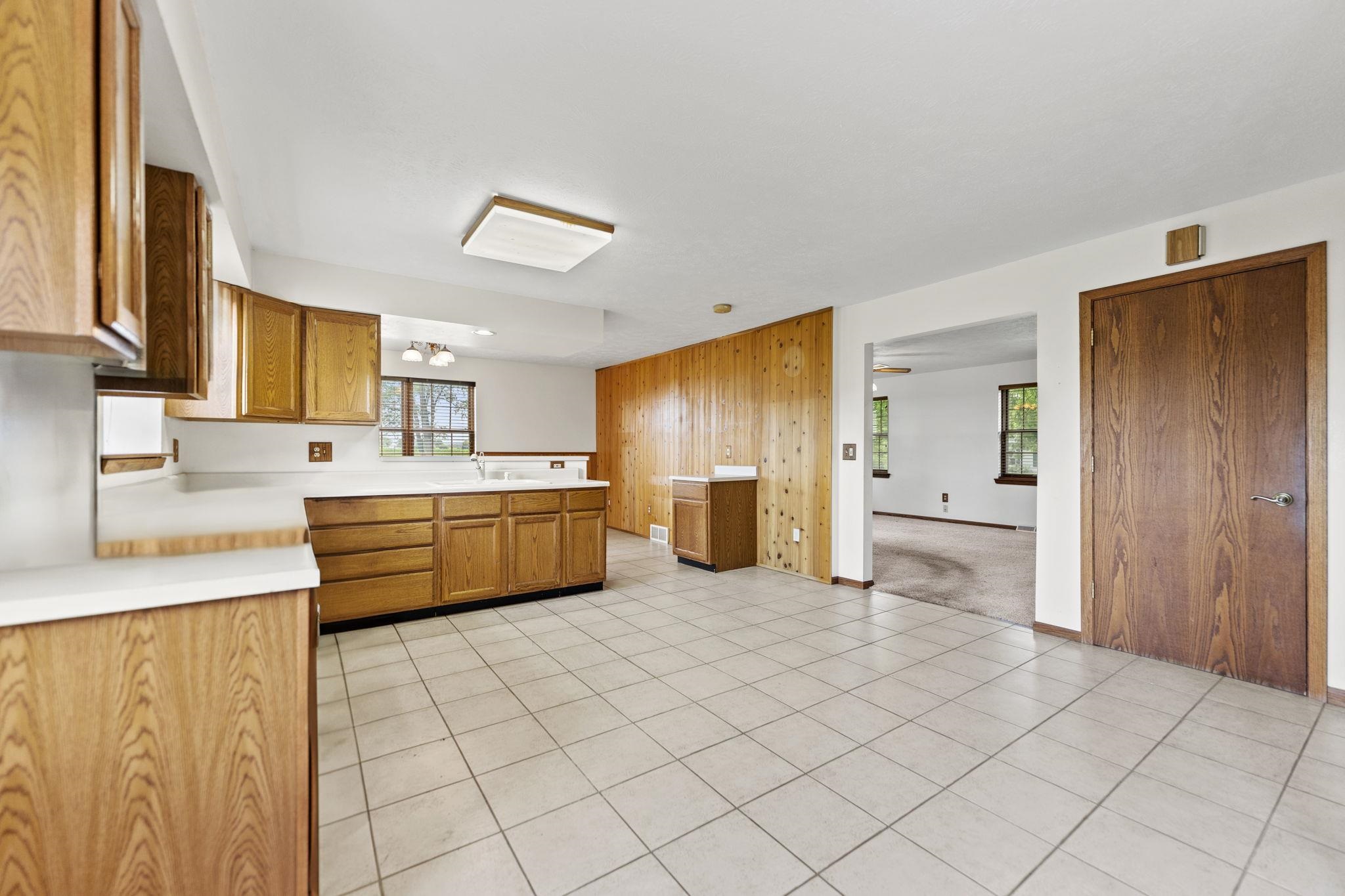 7918 Rothwell Road Rockford, IL 61109 - Photo 10 of 49 a kitchen with stainless steel appliances a sink and a refrigerator