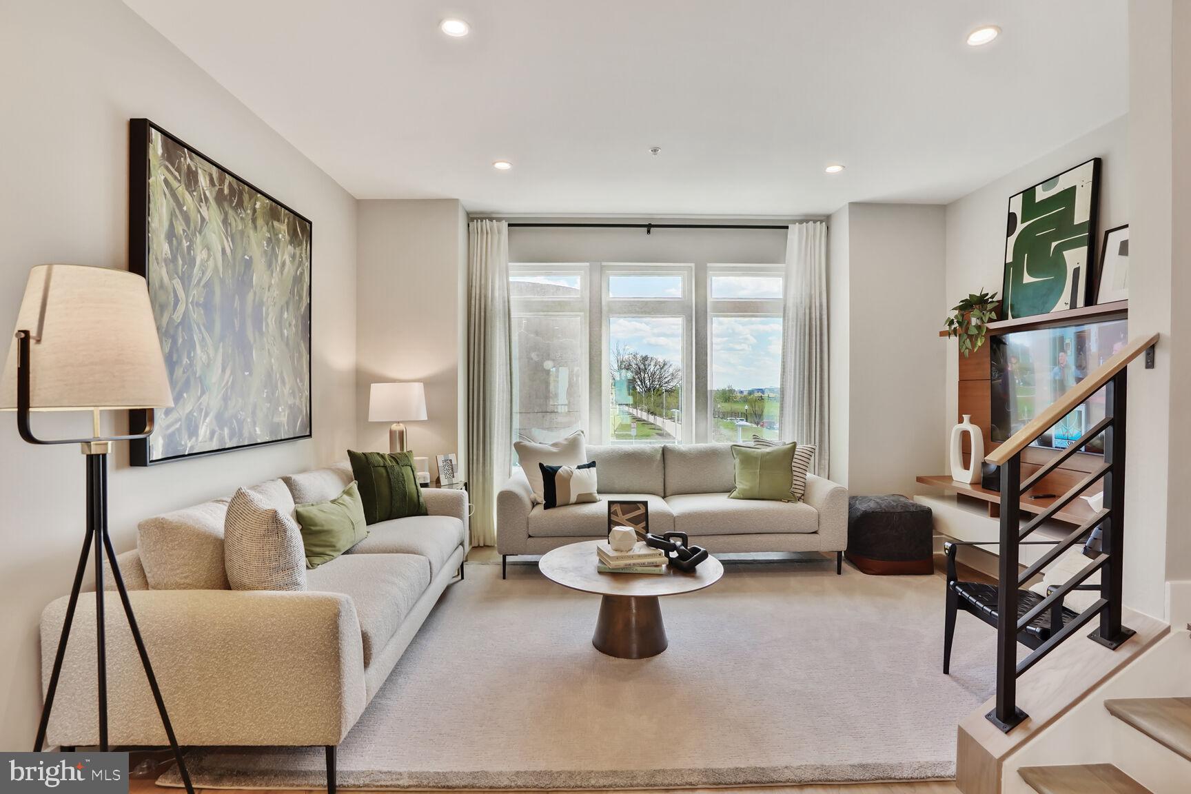 61 Lower Service Court Northwest Washington, DC 20422 - Photo 19 of 21 a living room with furniture or couch and a large window