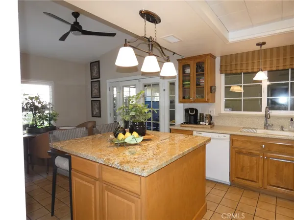 a kitchen with a counter space cabinets and appliances