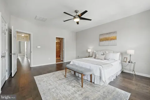 a bedroom with bed and a table