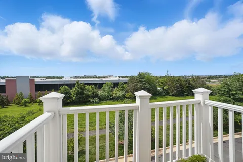 a view of a wooden fence and city