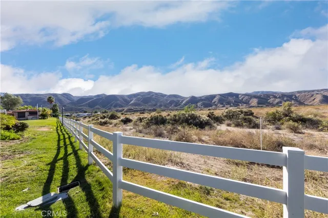 a view of a lake with houses in the background