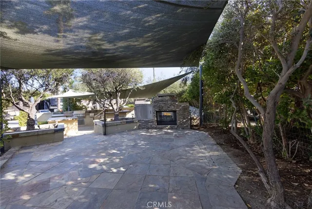 a view of a chairs and table in backyard