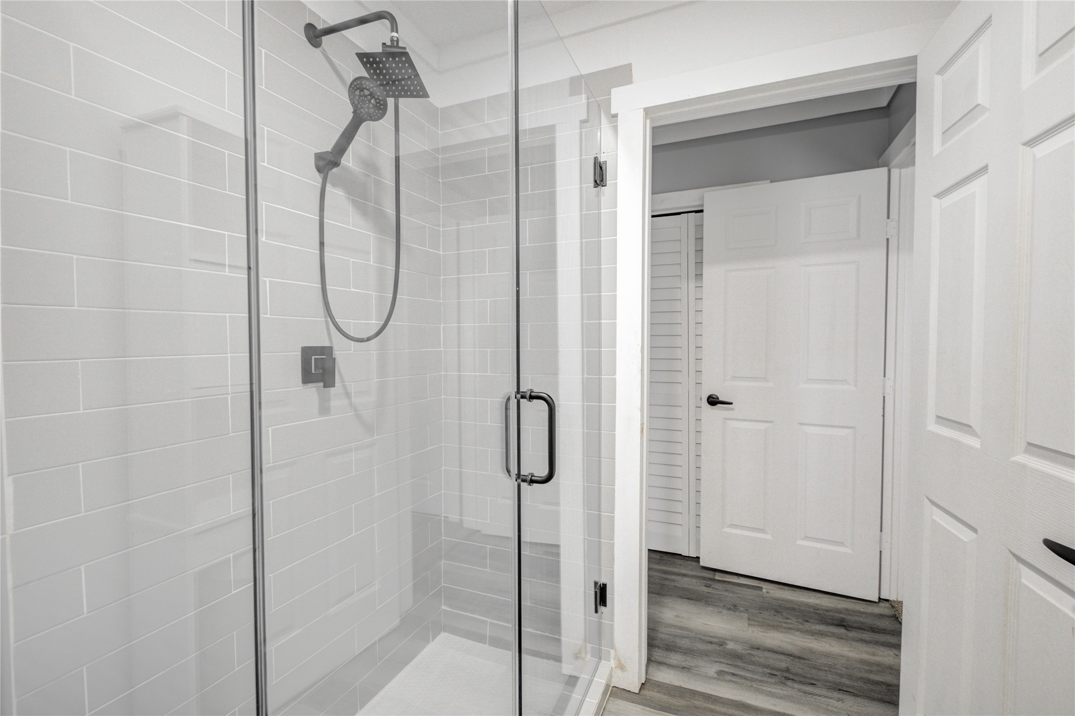 609 Hurst Place Angleton, TX 77515 - Photo 29 of 36 a bathroom with a glass shower door