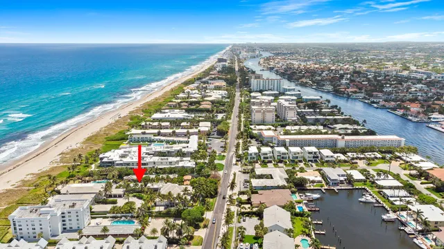 an aerial view of residential building and ocean view