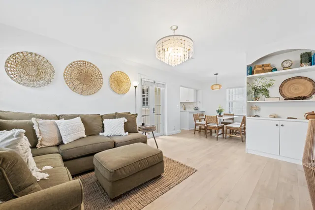a living room with furniture and a clock