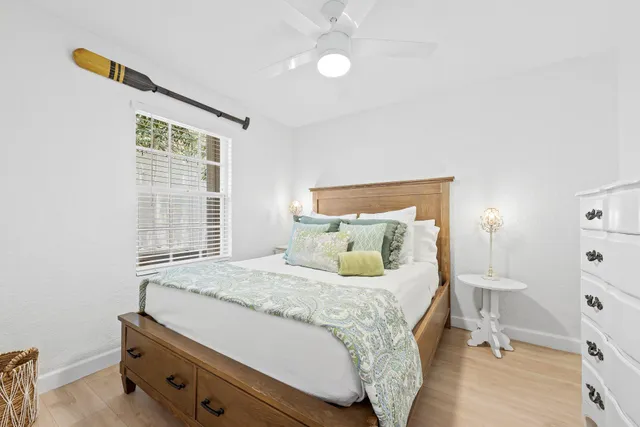 a bedroom with a bed and window