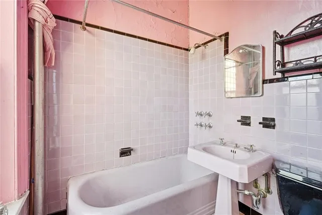 a bathroom with a sink and a bathtub