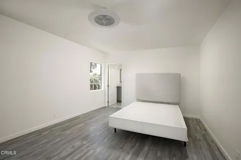 a room with a bed and a night stand