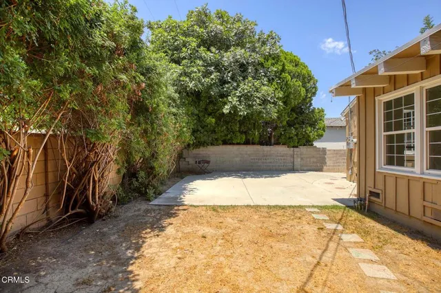 a view of a backyard of the house