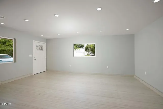 an empty room with windows