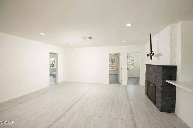 a view of a kitchen with a sink and a refrigerator