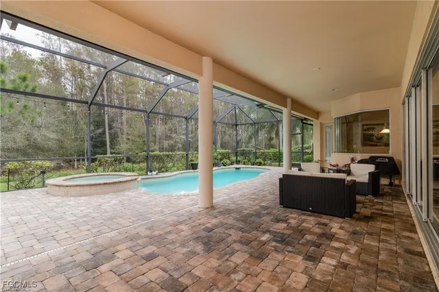a view of living room with furniture and floor to ceiling window