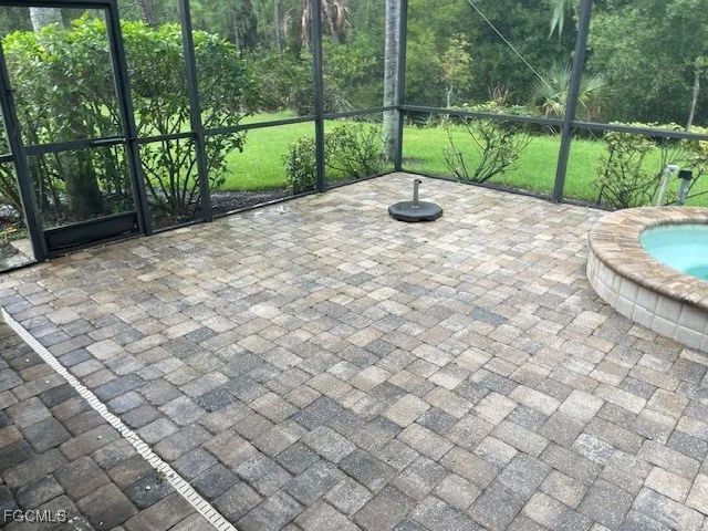 a view of a park with iron fence