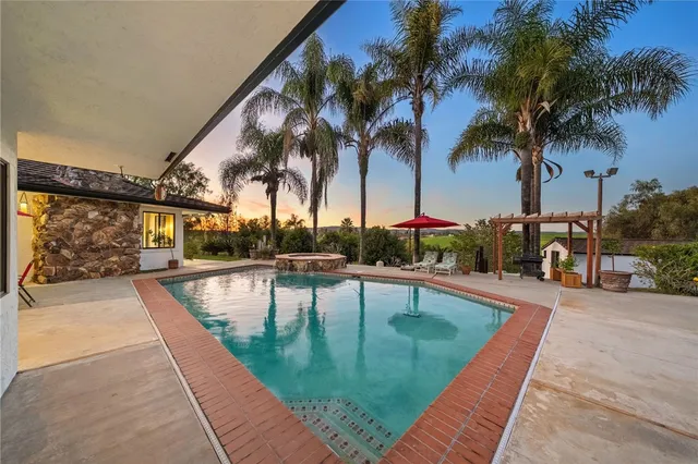 swimming pool with outdoor seating
