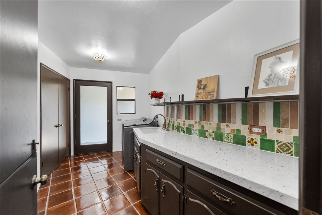 1650 Winterwarm Drive Fallbrook, CA 92028 - Photo 25 of 72 a kitchen with stainless steel appliances granite countertop a refrigerator and a stove