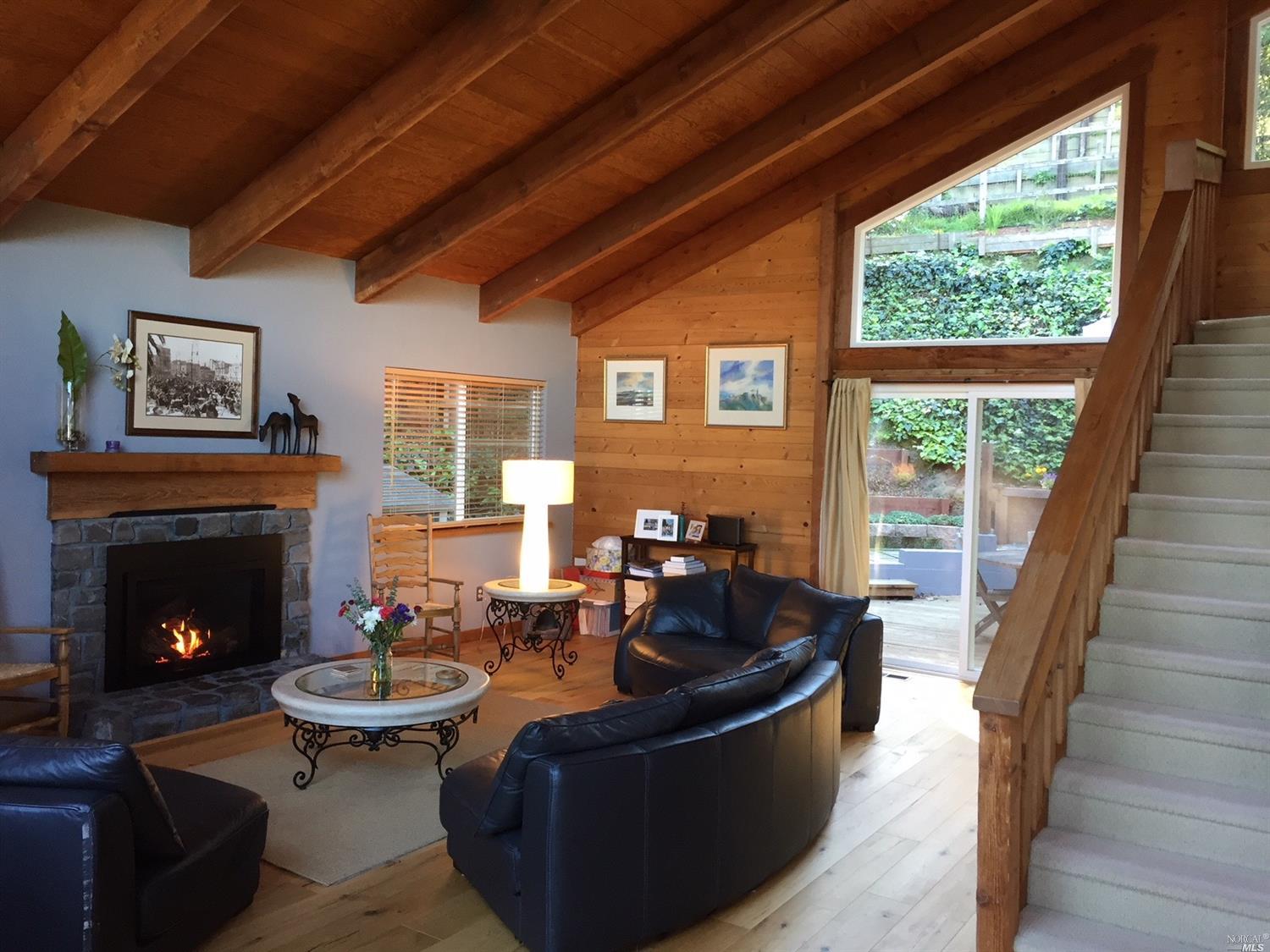 706 Bay Road Mill Valley, CA 94941 - Photo 1 of 1 a living room with furniture and a fireplace