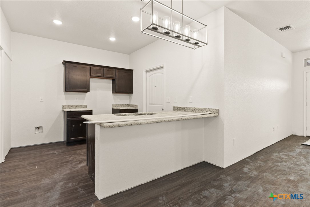 117 Leon Lane Kempner, TX 76539 - Photo 3 of 20 a kitchen with a refrigerator and a sink